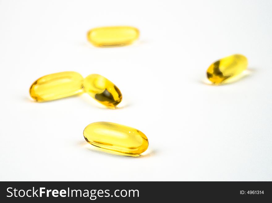 Cod liver oil tablets on a white background