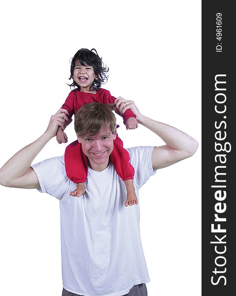 Father carrying laughing son on his shoulders. Father carrying laughing son on his shoulders
