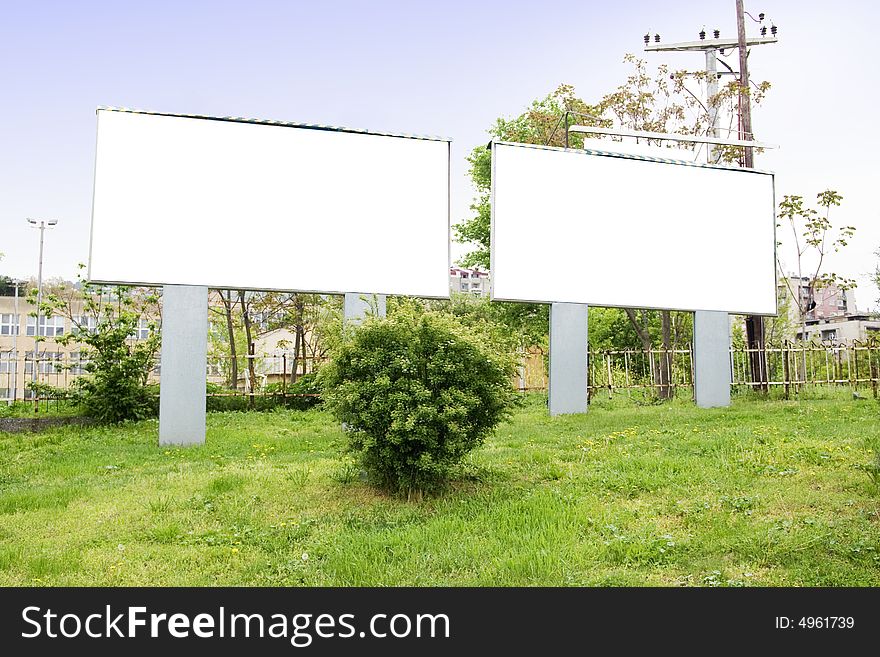 Blank billboard out of city