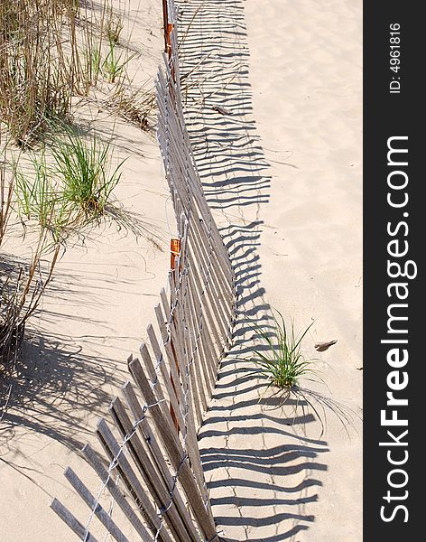 Beach sand dunes and fence. Beach sand dunes and fence