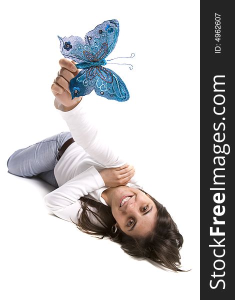 Beautiful young woman holding blue butterfly