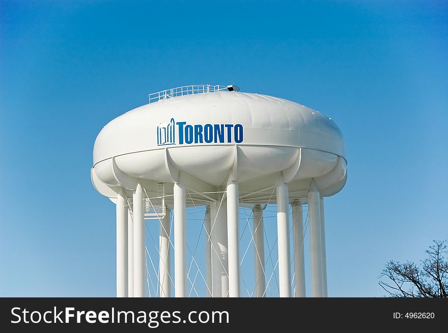 Municipality round water tower and blue sky in the background