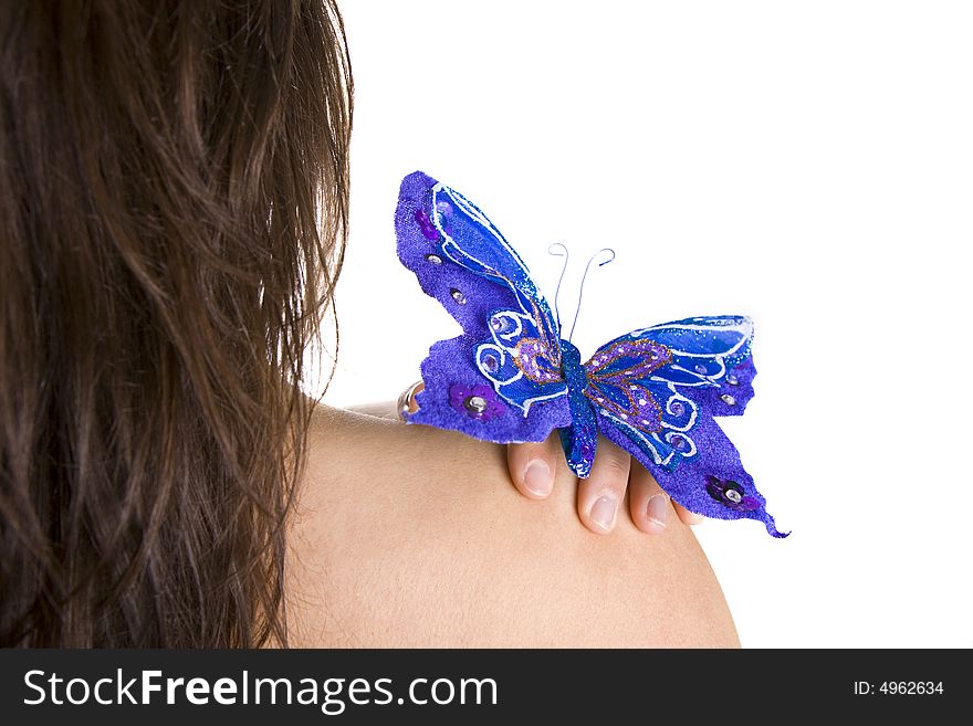 Beautiful young woman with blue butterfly in her naked shoulder