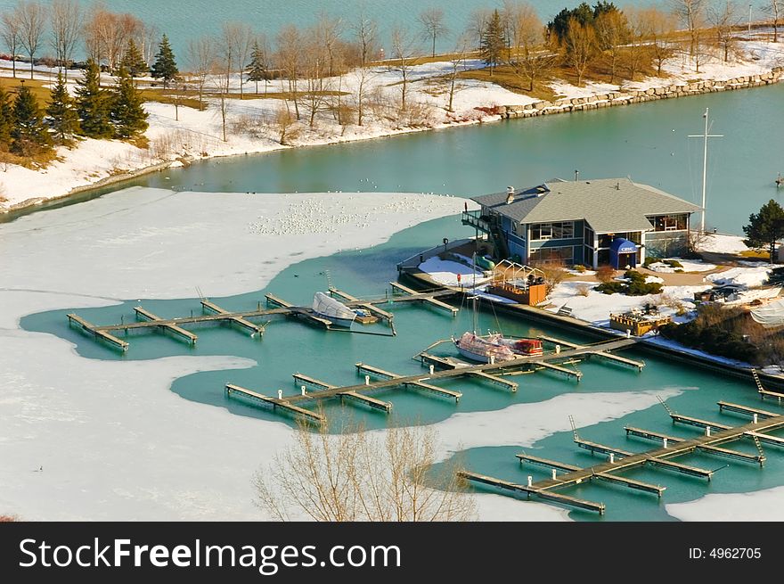 An urban marina seen here in winter time from top of a hill