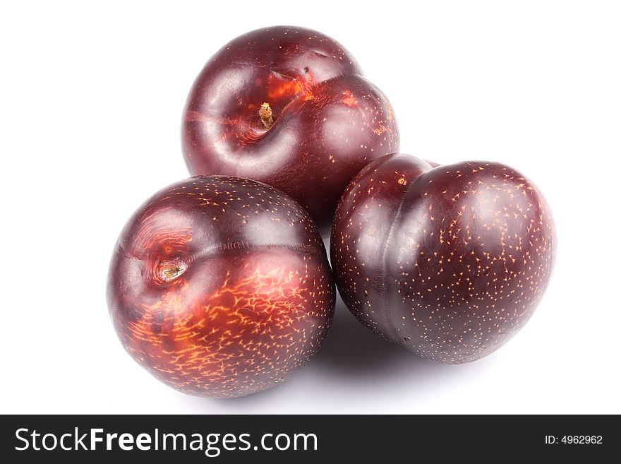 Appetizing juicy plum isolated on a white background. Appetizing juicy plum isolated on a white background