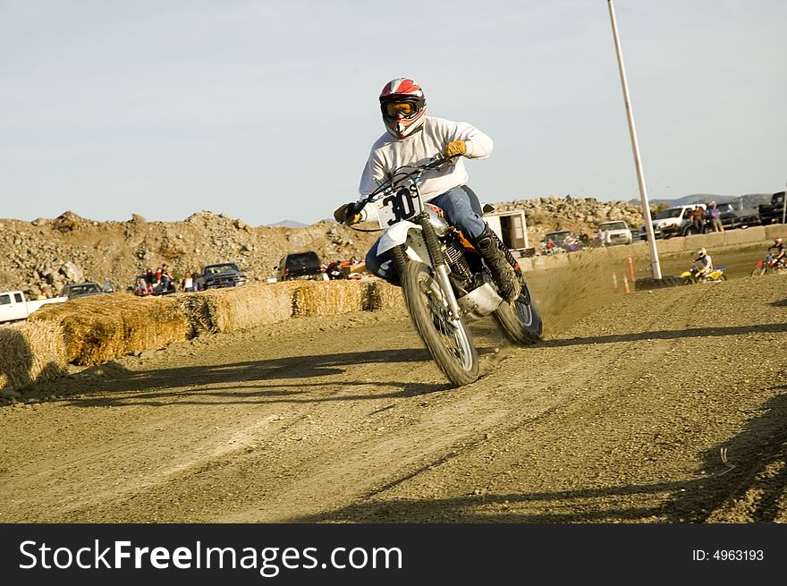 Dirt bike racer on racetrack