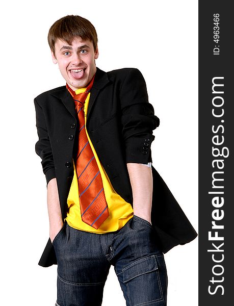 Funny handsome man wearing suit and necktie shows his tongue