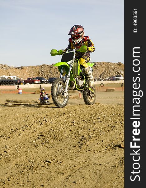 Dirt bike racer on track racing