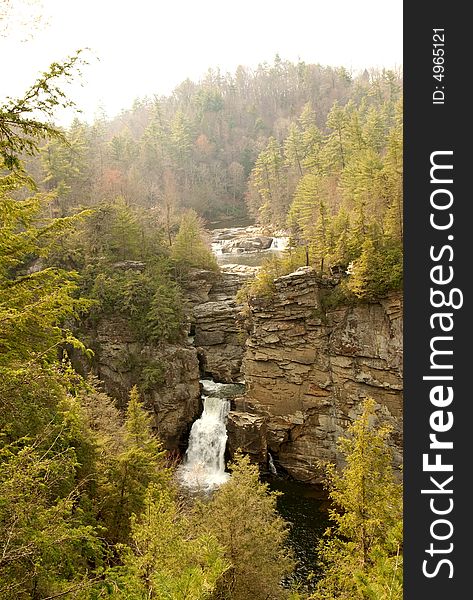 A waterfall on a cliff-side in rural North Carolina in Pisgah''s national forest. A waterfall on a cliff-side in rural North Carolina in Pisgah''s national forest.