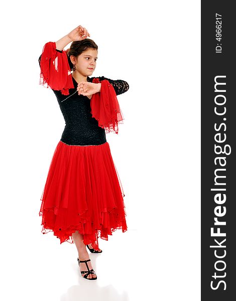 Attractive tween girl dancing the Pasodoble.  Isolated on white.