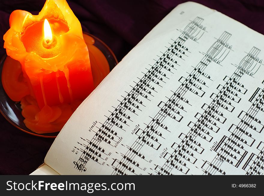 Candle With Sheet Music