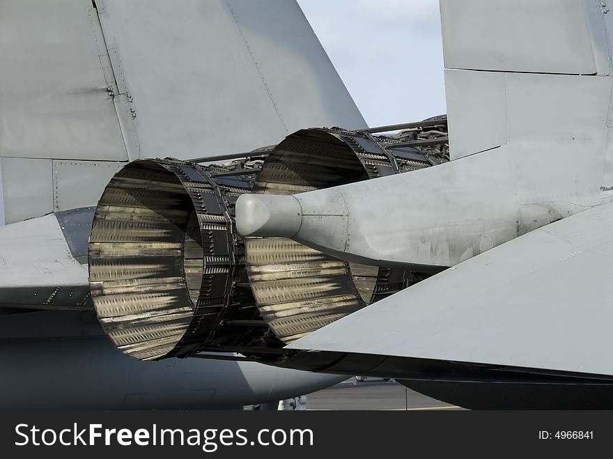 Rear detail with engine and afterburner of F-15 fighter aircraft. Rear detail with engine and afterburner of F-15 fighter aircraft.