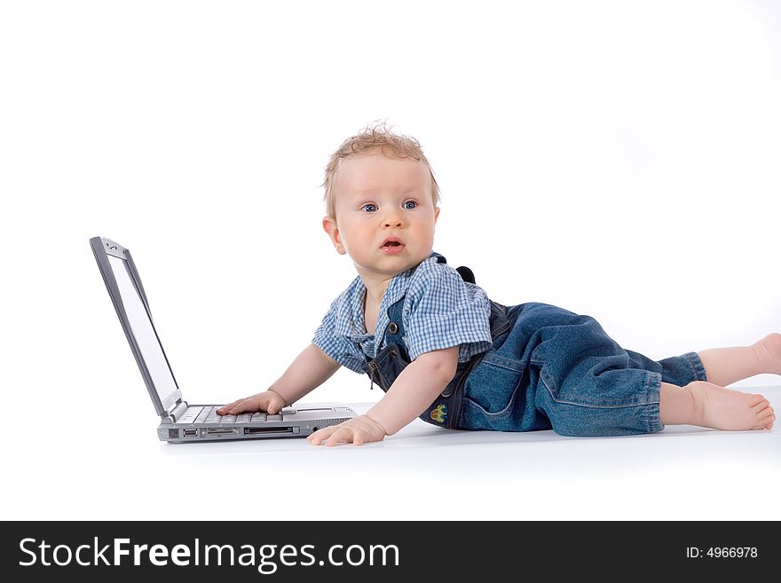 Baby with laptop on white