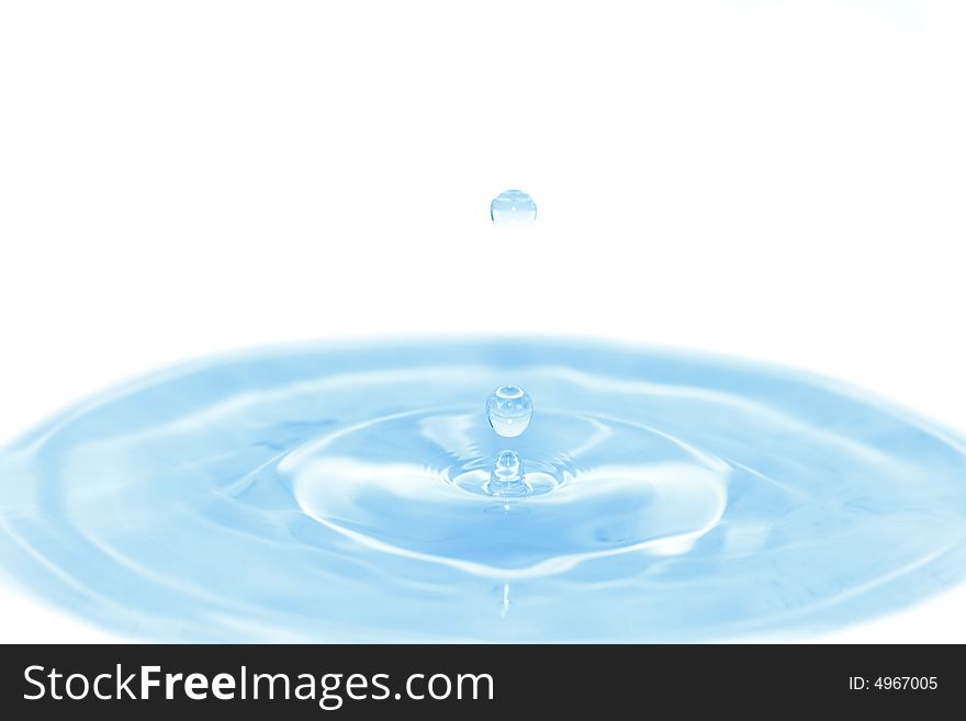 Blue water with falling drops on white. Use in your design!. Blue water with falling drops on white. Use in your design!