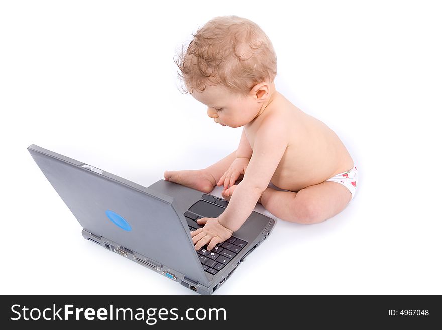 Baby with laptop on white
