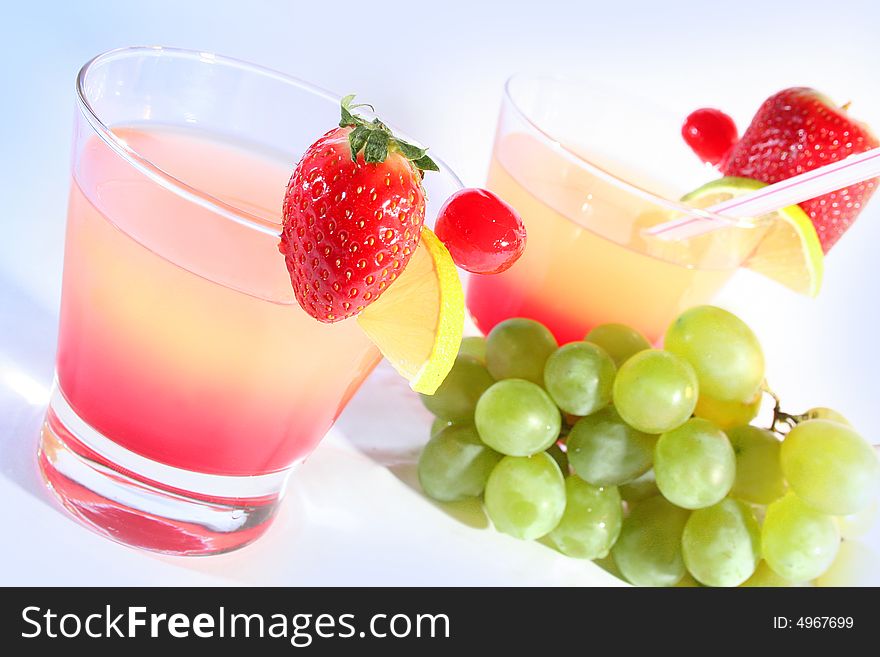 Bright sweet cocktails and fruits