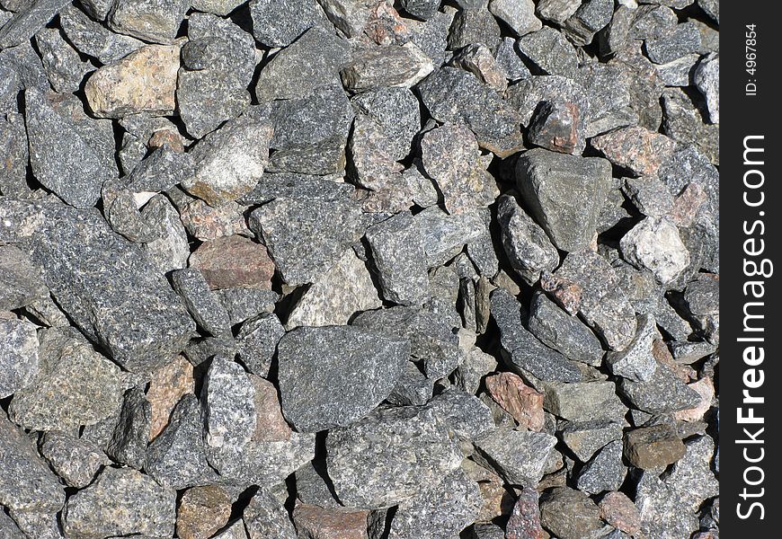 Large gravel background texture on railway embankment