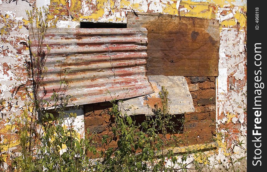 Window shutters on a derelict farm house near carletonville south africa