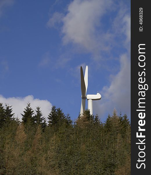Wind turbine behind trees, Lammermuir Hills, East Lothian, Scotland