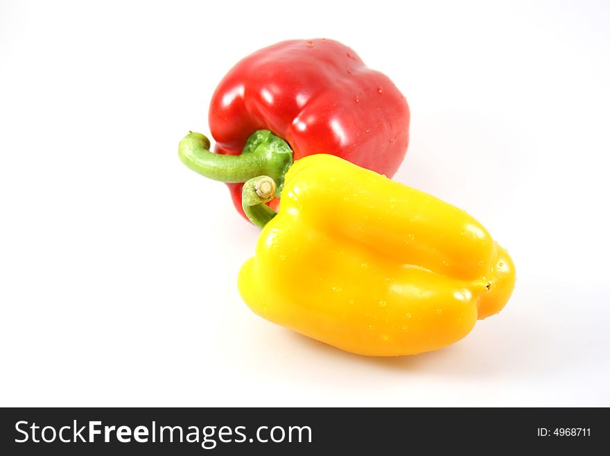 Isolated red and yellow paprikas