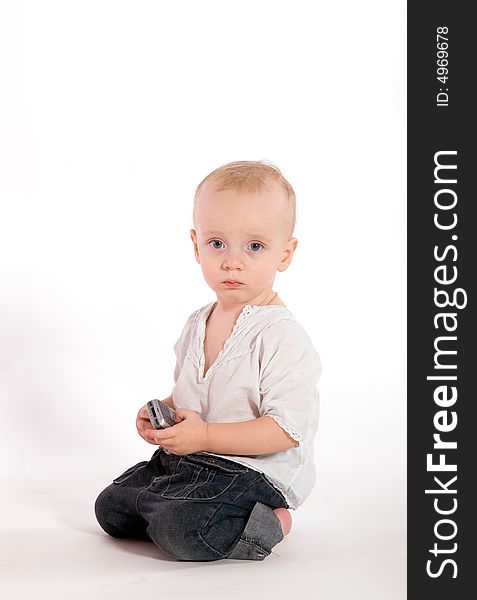 Sad baby with phone isolated on white