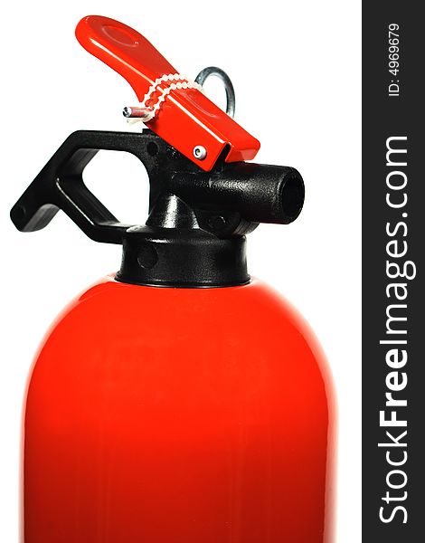Close - up of fire extinguisher over white.