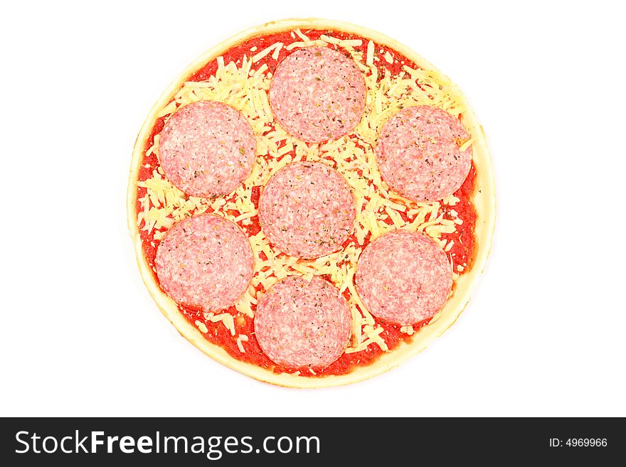 Uncooked, frozen pizza isolated on a white background.