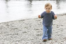 Baby Boy On Pebble Beach Royalty Free Stock Photo Baby Boy On Pebble Beach Royalty Free Stock Photo