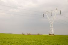 Electricity Pylons In The Green Fields Stock Photography