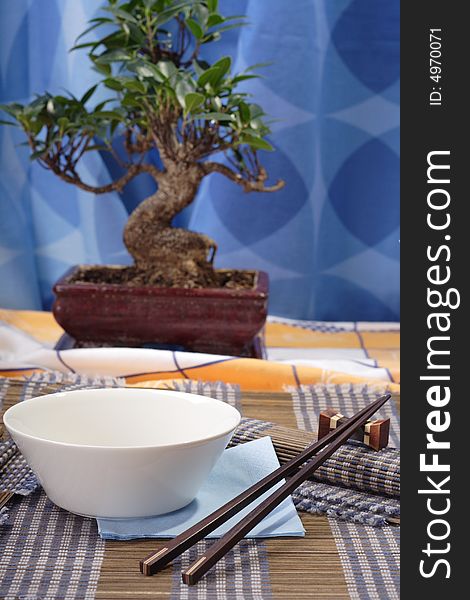 Asian style decorated table, soup bowl in the foreground