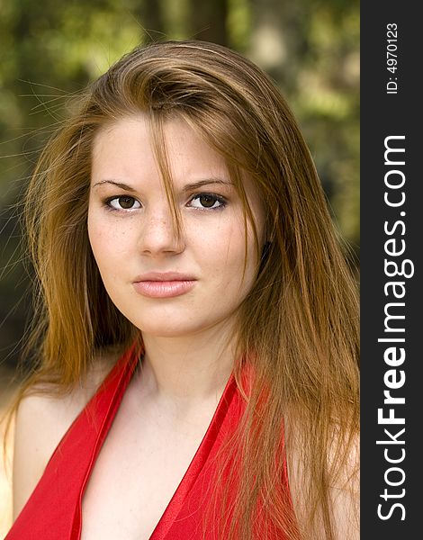 Sultry brunette in red dress