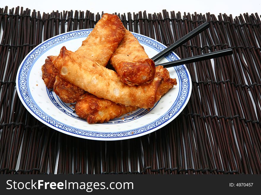 Spring Rolls On Plate With Chopsticks