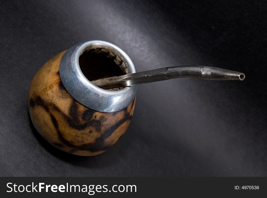 Сup from calabash with yerba mate tea and straw. Сup from calabash with yerba mate tea and straw.