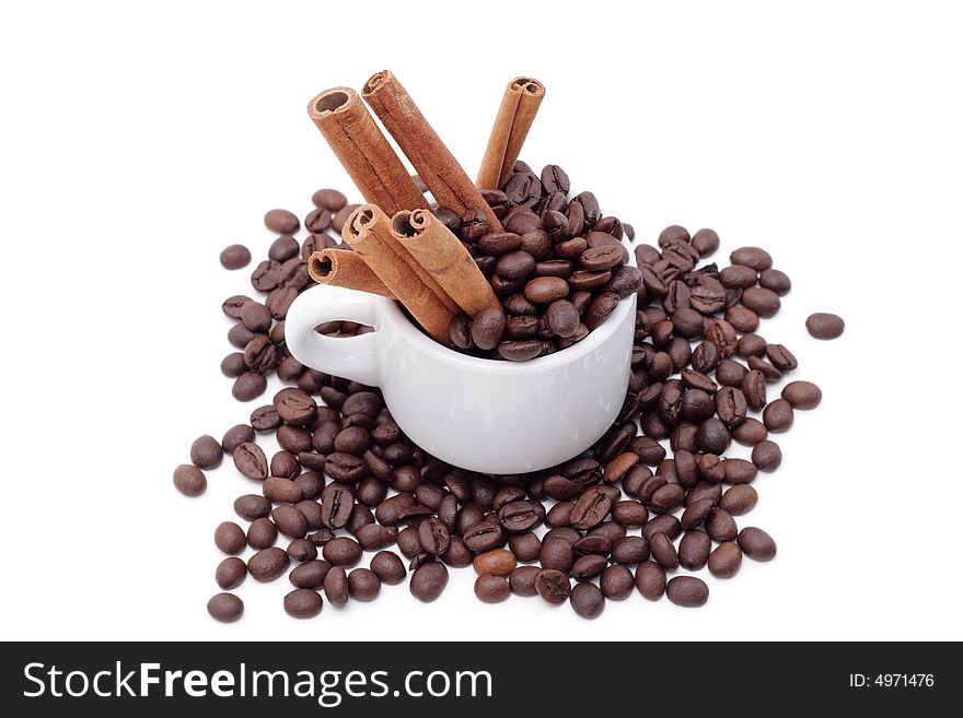 Cofee seed in a cup isolated on a white background