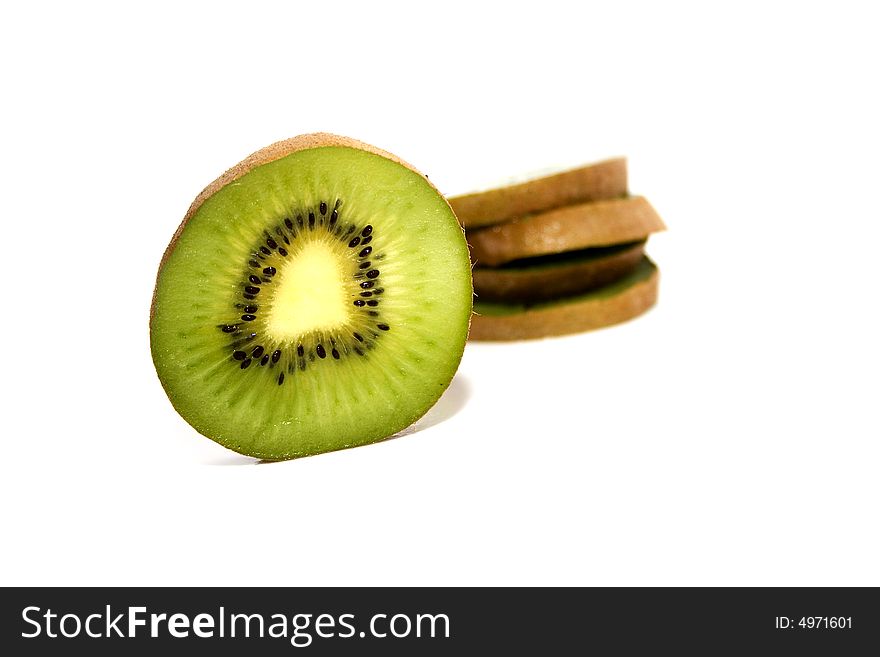 Vivid green kiwi slices isolated on white