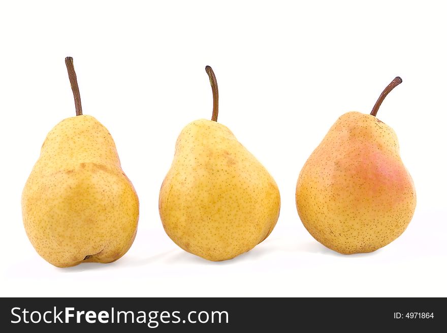 Three yellow pear isolated on the white background. Three yellow pear isolated on the white background