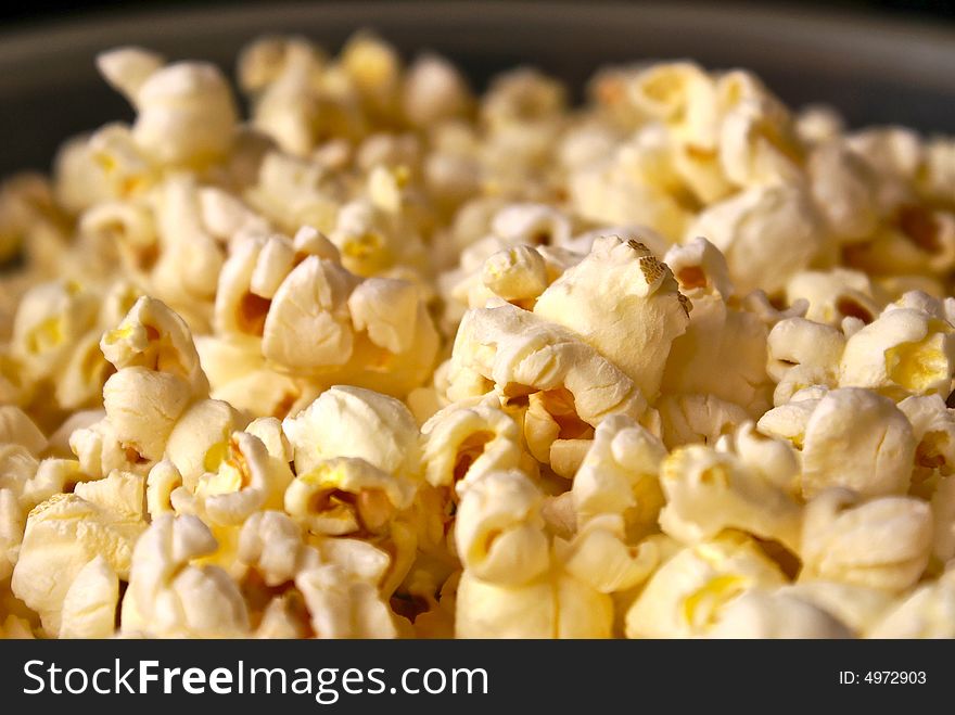 Detail close up of fresh popped buttered popcorn. Detail close up of fresh popped buttered popcorn
