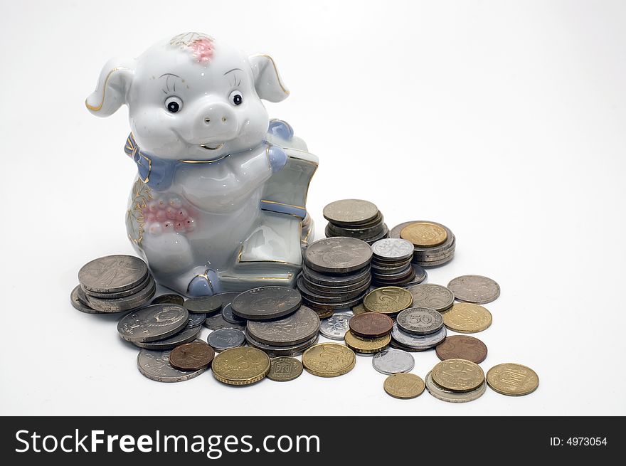 Piggy bank swine. Coin pile isolated on white background. Piggy bank swine. Coin pile isolated on white background.