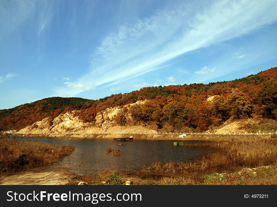 Colorful hill lying front the blue sky in autumn. Colorful hill lying front the blue sky in autumn.