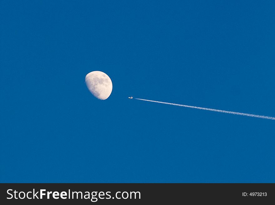 Plane flying by the moon. Plane flying by the moon