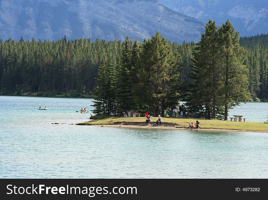 People enjoying a warm summer day at the lake. People enjoying a warm summer day at the lake