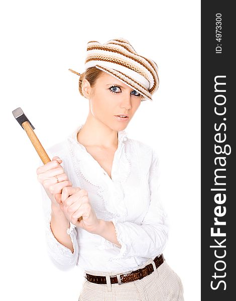 Cute businesswoman in cap with a hammer on white background. Cute businesswoman in cap with a hammer on white background