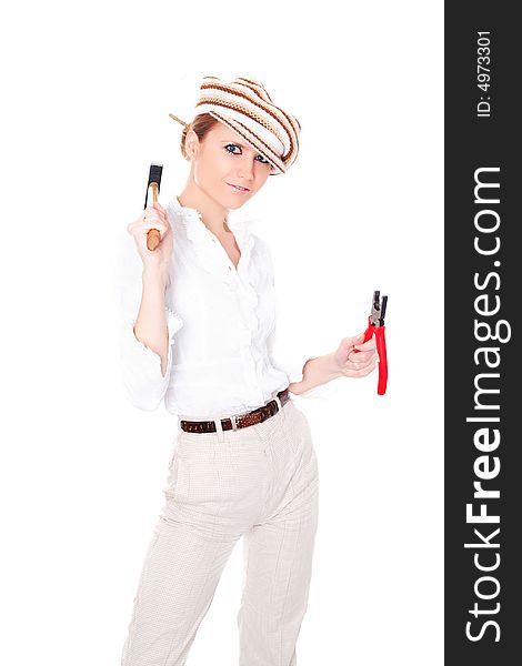 Cute businesswoman in cap with tools on white background. Cute businesswoman in cap with tools on white background