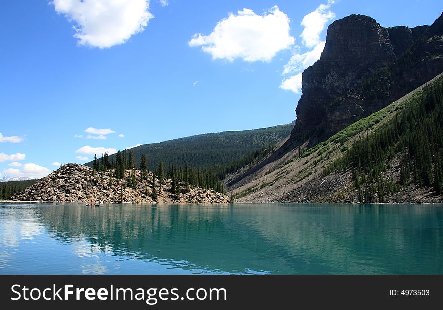 Amazing crystal blue lake reflecting the surrounding scenery in the Canadian Rockies. Amazing crystal blue lake reflecting the surrounding scenery in the Canadian Rockies