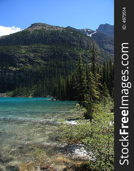 Glacial runoff pouring into an amazing crystal blue lake in the Canadian Rockies. Glacial runoff pouring into an amazing crystal blue lake in the Canadian Rockies