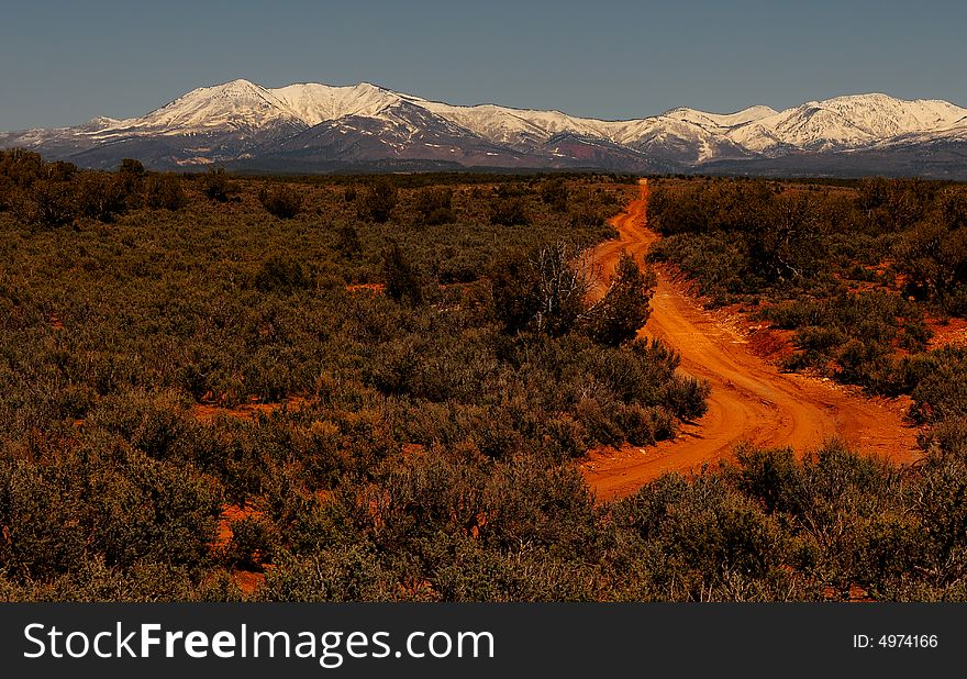 Nice image of a dirt road to the mountains