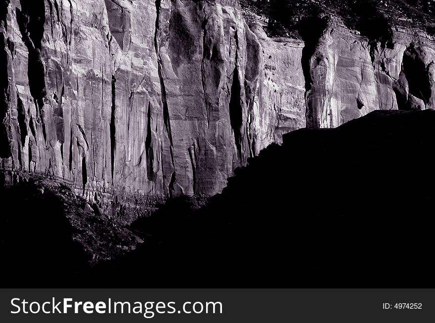 Interesting Black and White Image of a rockface In Monument valley. Interesting Black and White Image of a rockface In Monument valley