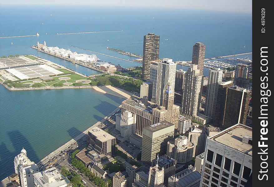 Photograph taken from John Hancock Observatory at 94th Floor. Backdrop in the image has Lake Michigan providing an opening to chicago River in the downtown Chicago area.
