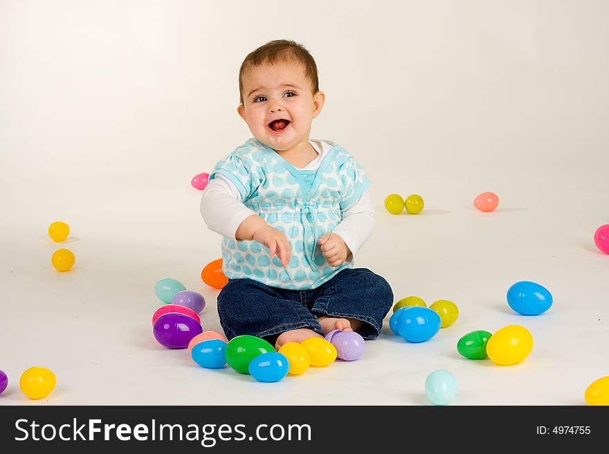 Cute baby girl with easter plastic eggs. Cute baby girl with easter plastic eggs