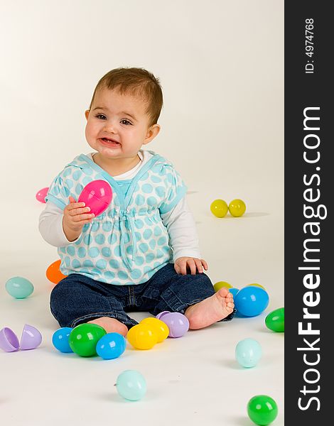 Cute baby girl with easter plastic eggs. Cute baby girl with easter plastic eggs